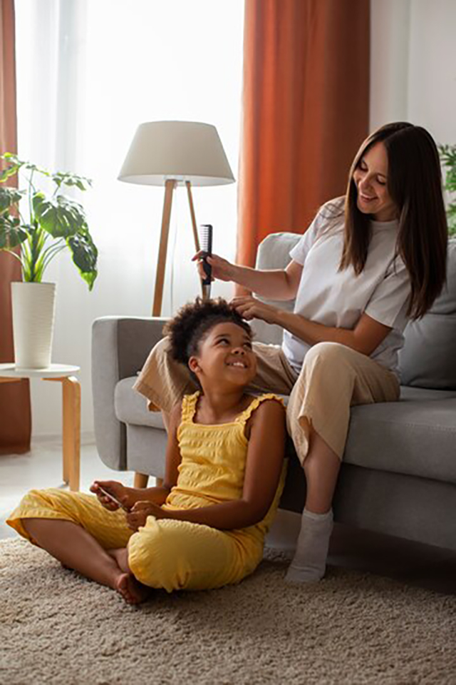 mom-helping-her-child-styling-afro-hair_23-2149625723